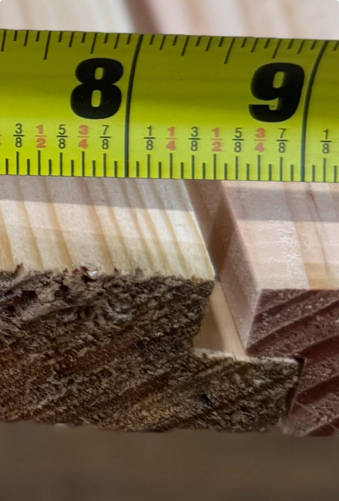 board with a measuring tape showing dimensions